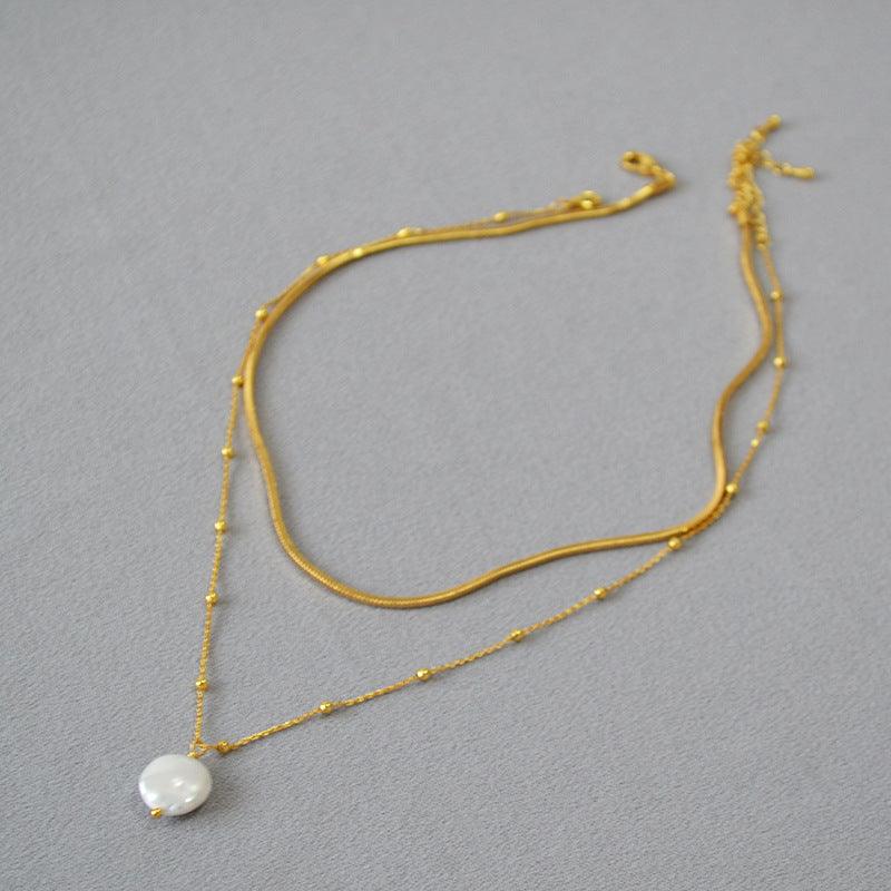 Chic women's layered necklace with irregular baroque pearls, gold-plated sterling silver, and an elegant design.