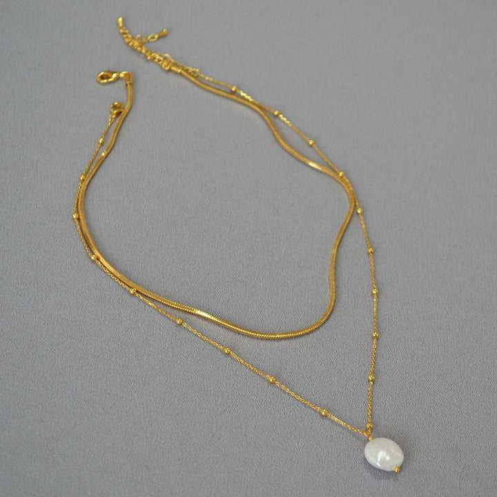 Beautiful women's layered baroque pearl necklace, an elegant gold-plated statement piece for stylish fashion.