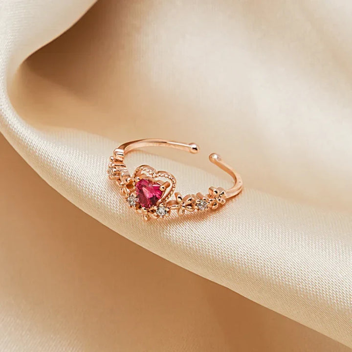Stunning Scarlett women's ring featuring a vibrant red crystal love design, adorned with shimmering AAA Zirconia.