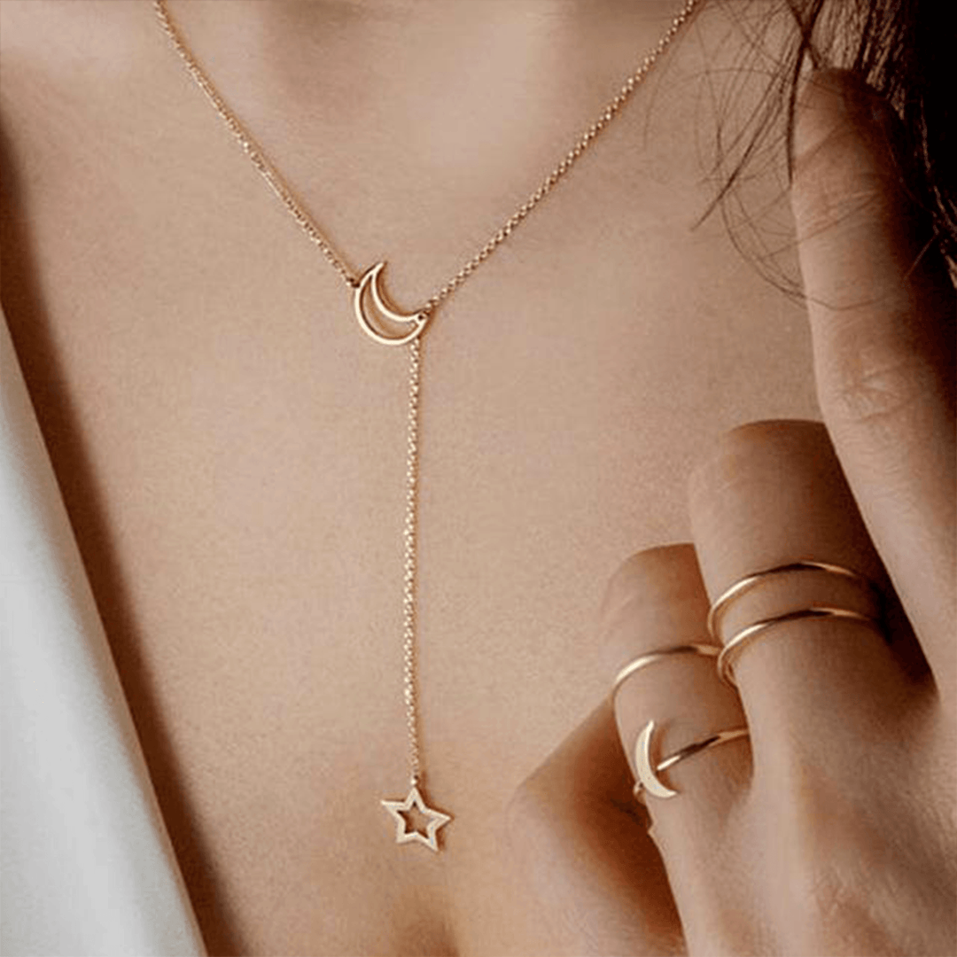 Elegant gold plated women's star & moon celestial layered necklace, a sophisticated fashion accessory & gift for her.