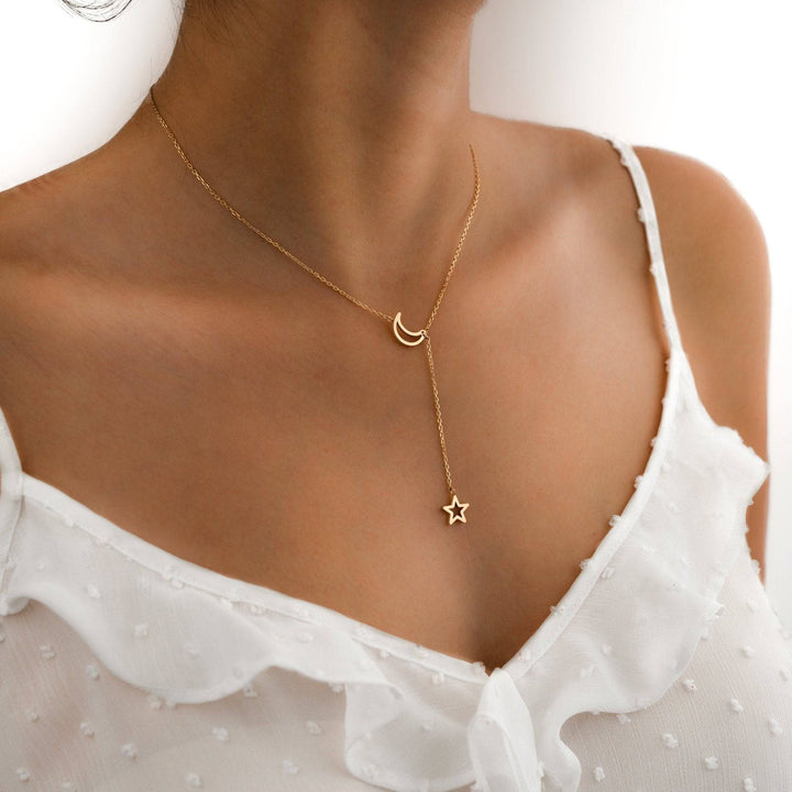 Women's elegant gold plated celestial star & moon necklace, a fashionable layered accessory and thoughtful gift.