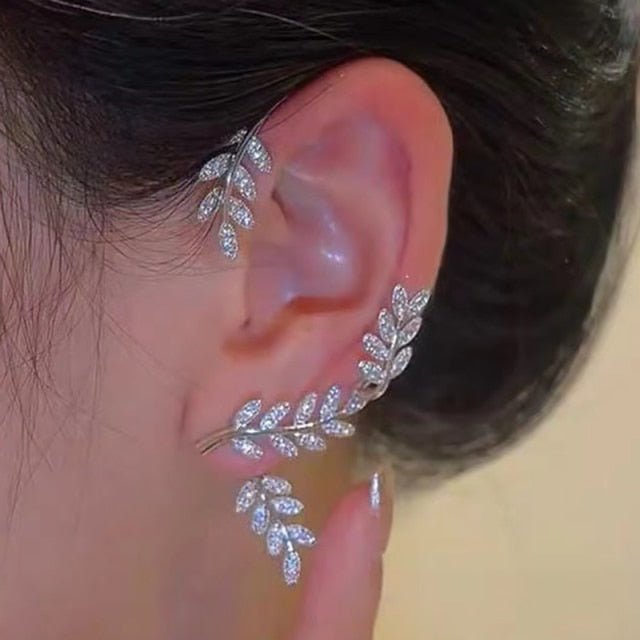 Dainty gold-tone star clip earrings. Elegant, adjustable, and non-pierced for women seeking subtle style.