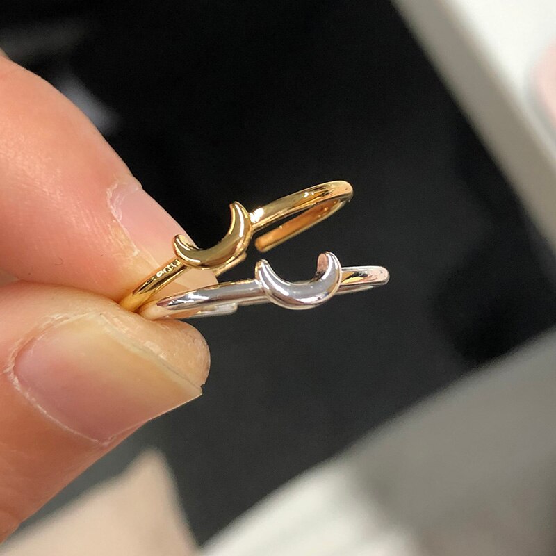 Sleek silver tone minimalist crescent ring for women, an adjustable & stylish stackable jewelry piece.