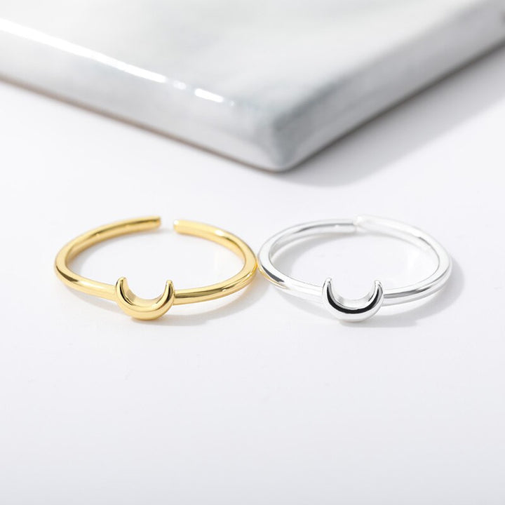 Women's Nova minimalist crescent ring, an elegant adjustable fashion accessory in a modern design.