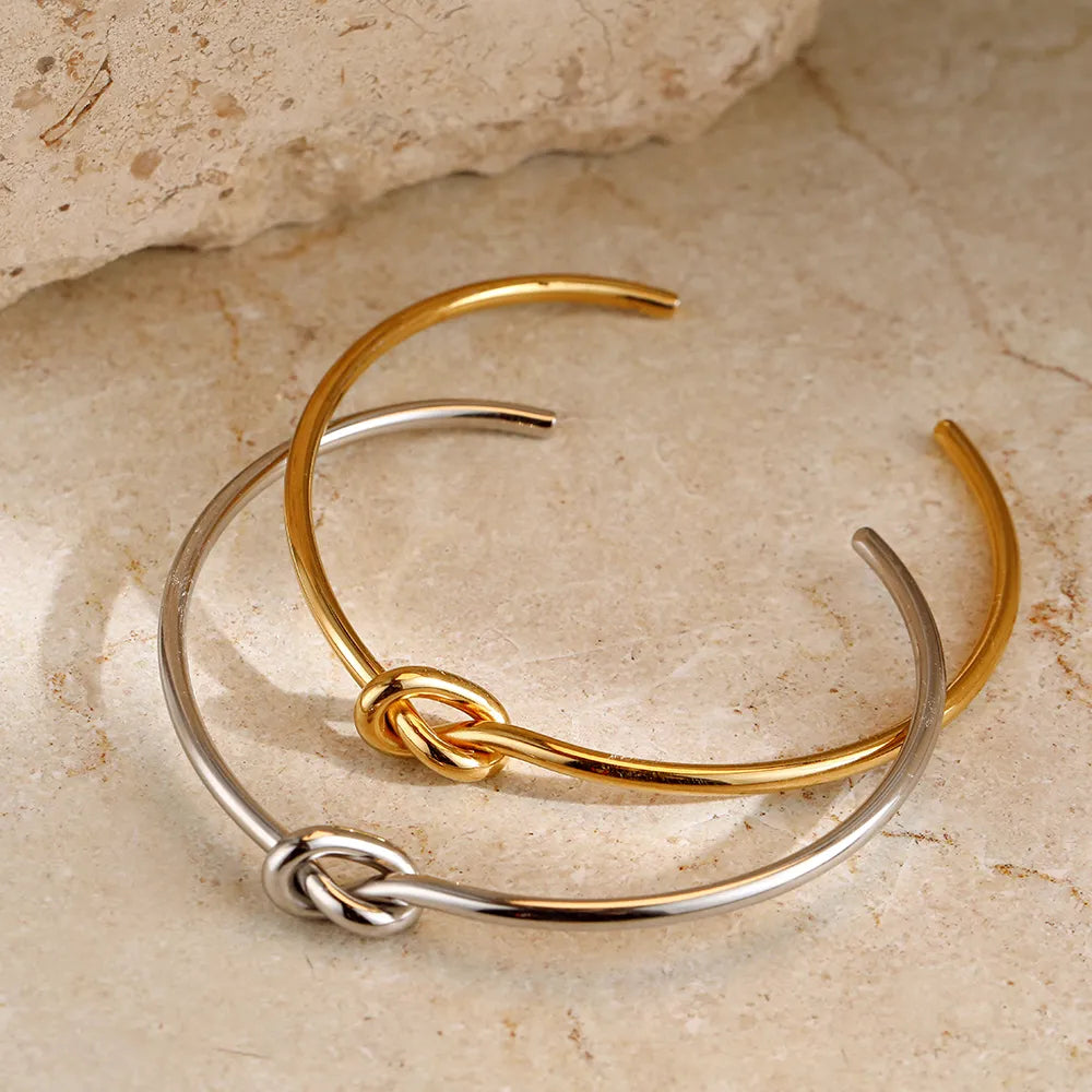 Beautiful gold twisted knot bracelet, an elegant women's accessory for any occasion.