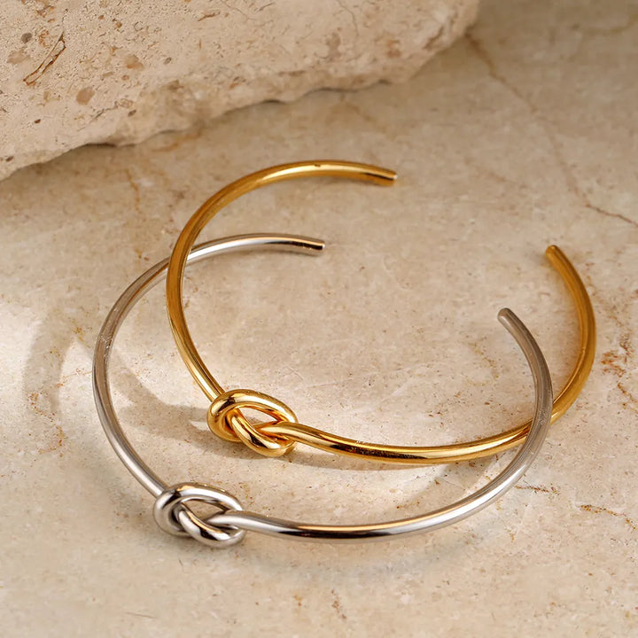 Beautiful gold twisted knot bracelet, an elegant women's accessory for any occasion.
