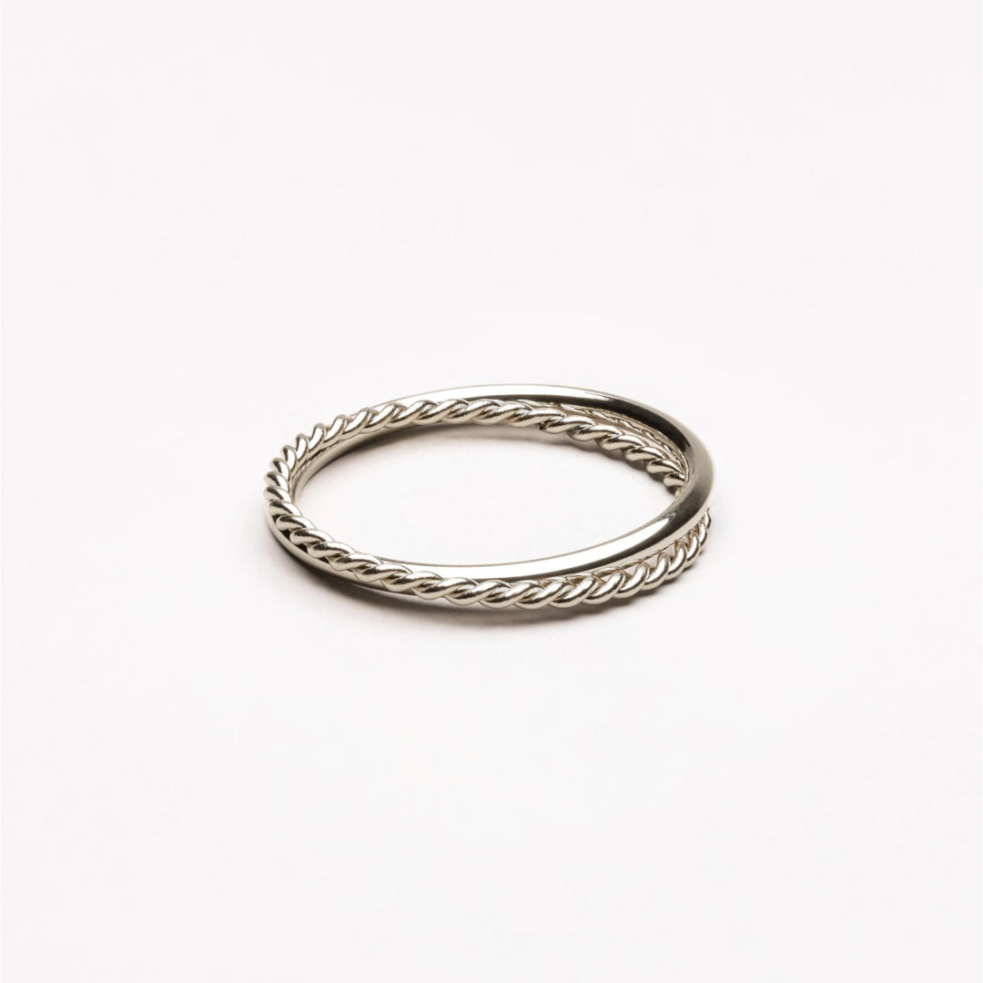 Gold women's stackable Harmony double band ring, elegant Lyra design jewelry.