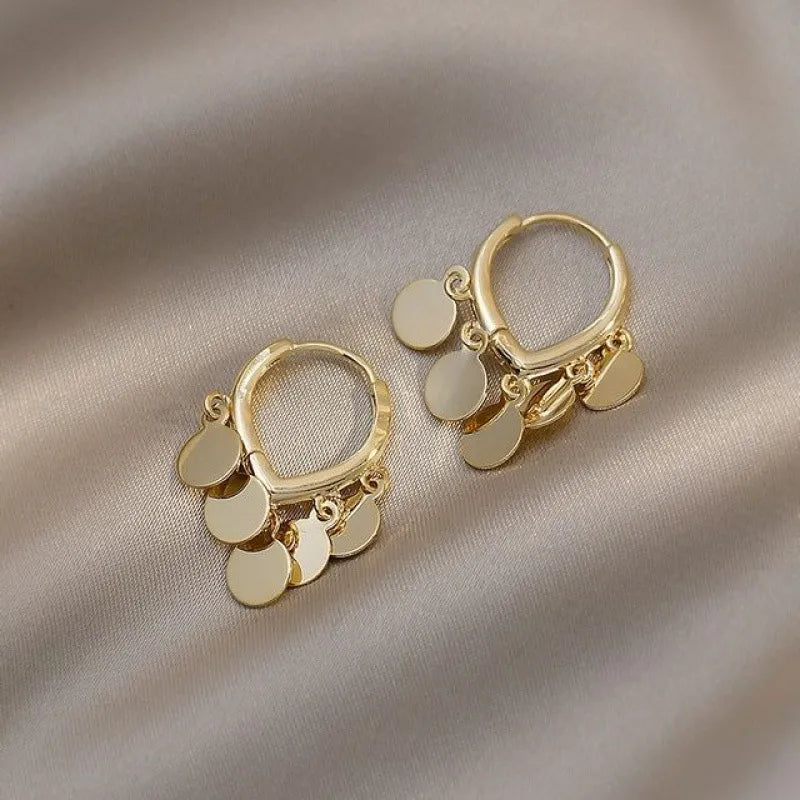 Elegant golden boho hoop earrings for women, a chic fashion accessory. Perfect statement jewelry.