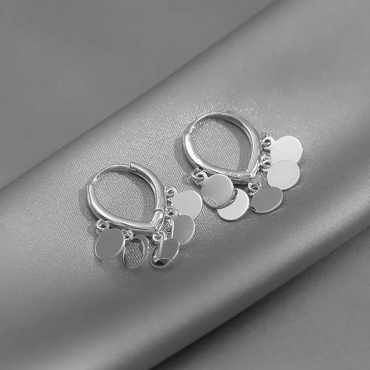 Trendy silver-plated boho hoop earrings for women. Stylish bohemian jewelry & fashion accessory.