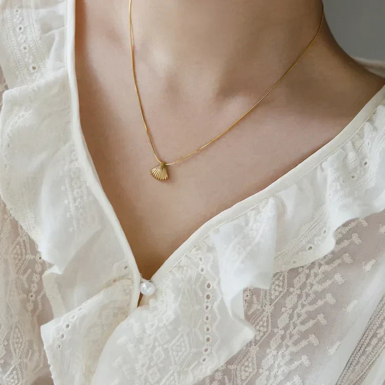 Women's natural design necklace: Golden scallop flower with lilac hues, gold plated sterling silver.