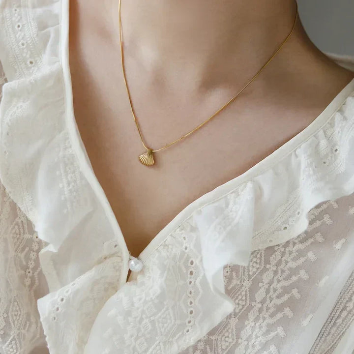 Women's natural design necklace: Golden scallop flower with lilac hues, gold plated sterling silver.