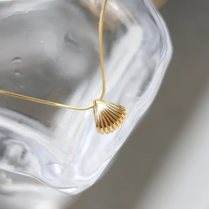 Delicate women's golden scallop & lilac flower pendant necklace, crafted from gold plated sterling silver.