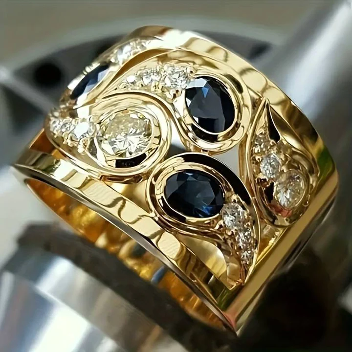 Elegant golden women's ring featuring captivating blue vintage crystals, perfect for a classic look.