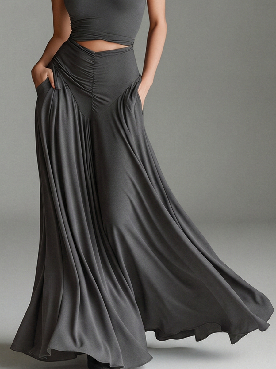 Sophisticated gray women's maxi dress. Features a chic halter neckline, daring waist cutout, and elegant ruched skirt detail.