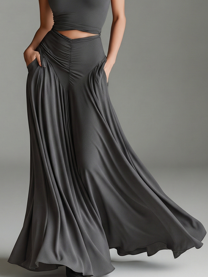Sophisticated gray women's maxi dress. Features a chic halter neckline, daring waist cutout, and elegant ruched skirt detail.