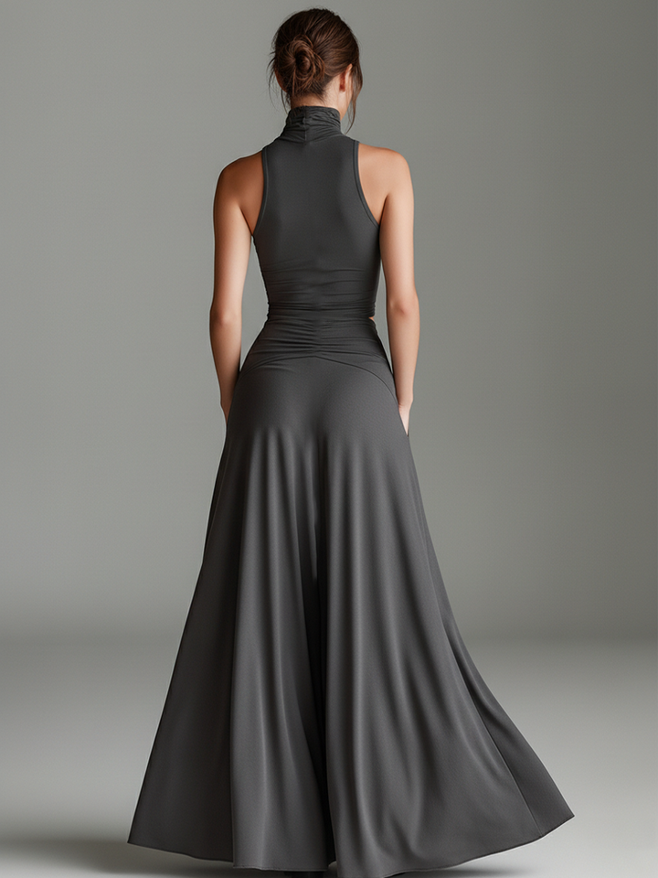 Women's sophisticated gray halter maxi dress, featuring a tasteful cutout and a figure-enhancing ruched skirt. Ideal for formal events.