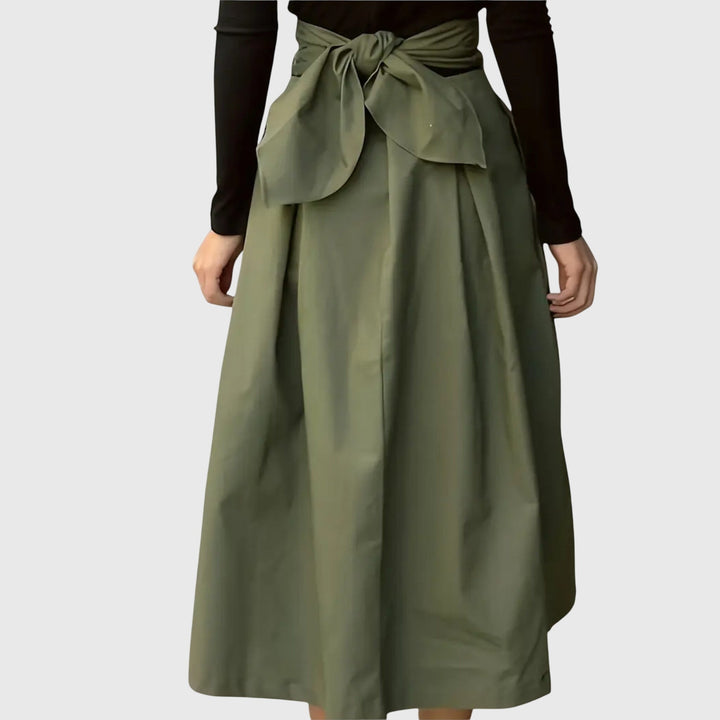 Fashionable green A-line midi skirt, an elegant women's bottom for versatile styling from office to casual events.