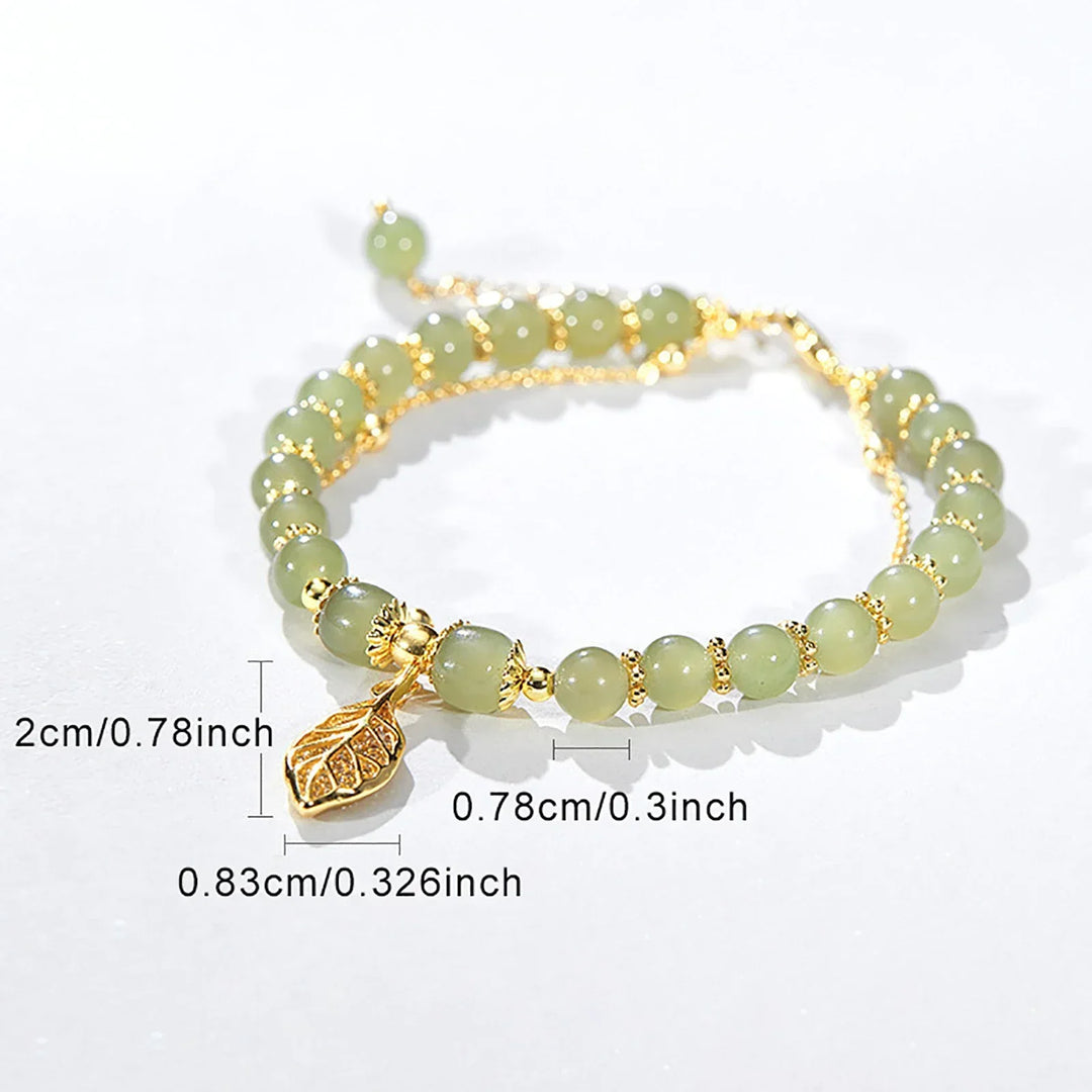 Vibrant green jade leaf bracelet for women. Adjustable natural stone jewelry, perfect for elegant style.