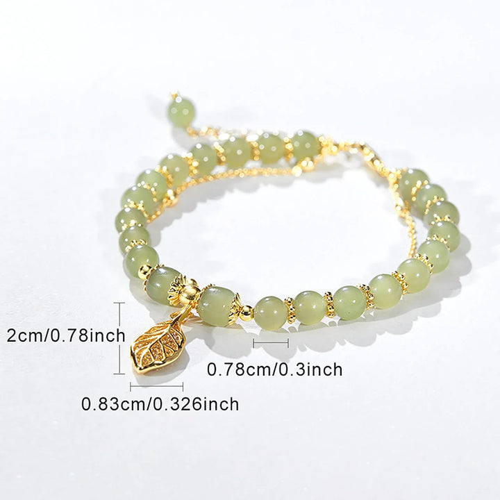 Vibrant green jade leaf bracelet for women. Adjustable natural stone jewelry, perfect for elegant style.
