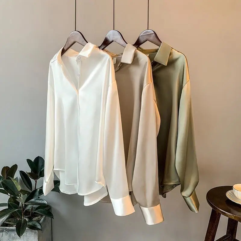 Chic white long-sleeve women's shirt blouse, perfect for a modern professional or casual look.