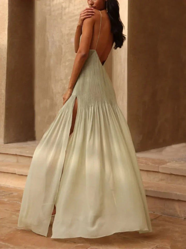 Flowing women's V-neck maxi dress with elegant pleats, perfect for evening wear & special occasions.