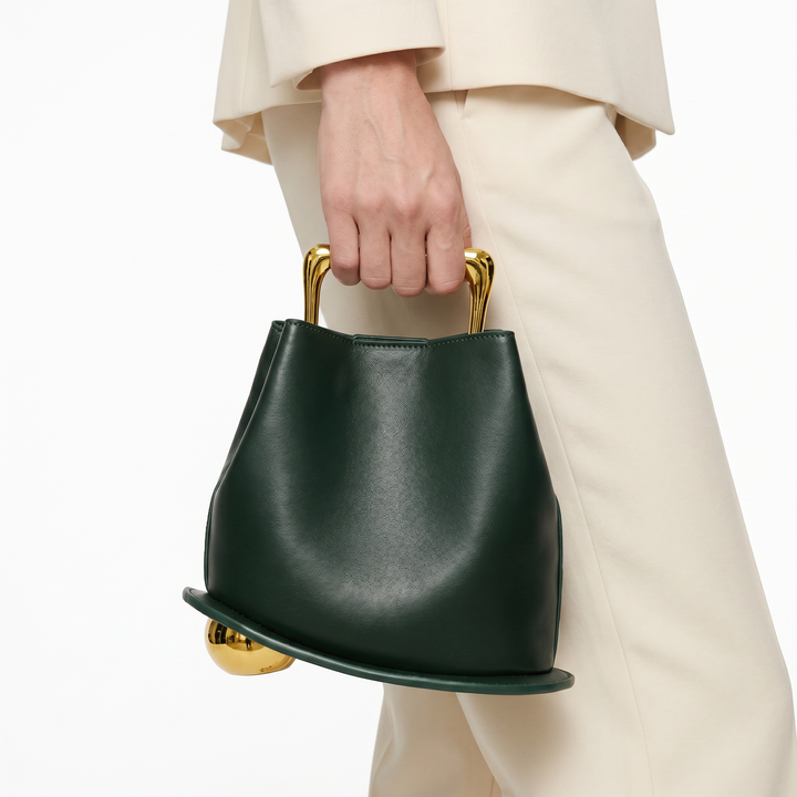 Elegant green PU leather bucket bag for women, structured daily carry handbag.