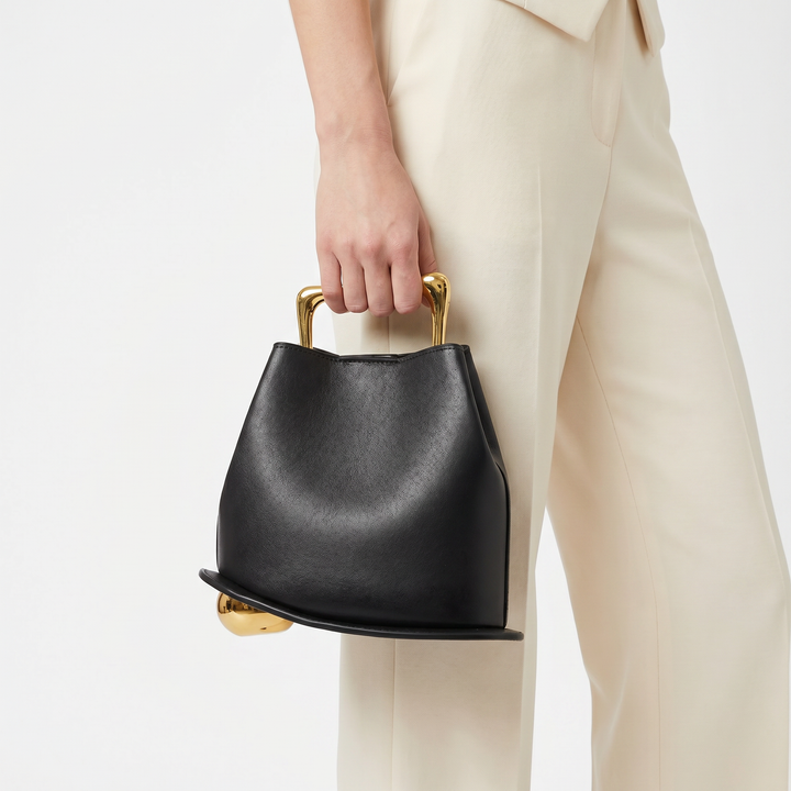 Chic black bucket bag for women, versatile PU leather everyday handbag.