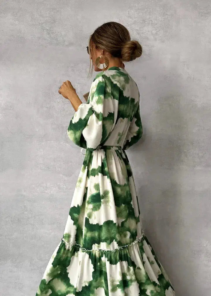Long formal women's maxi dress with elegant puff sleeves, V-neck, and tie waist. A beautiful special occasion gown.