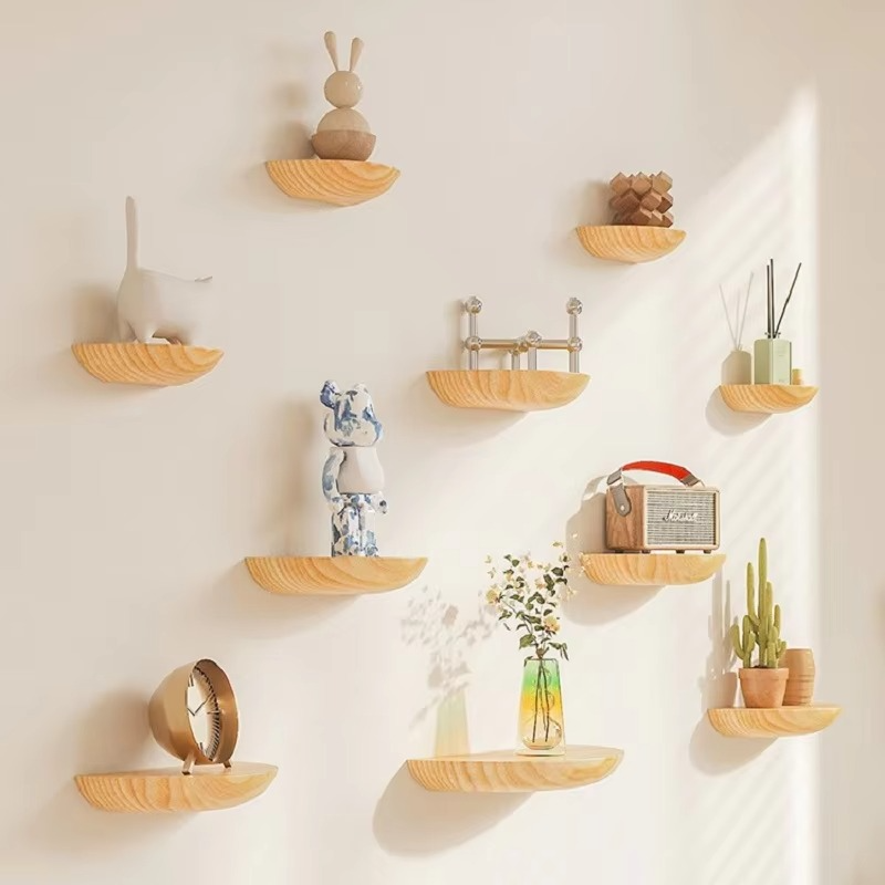 Elegant half-round wooden floating shelf for modern wall decor & storage in living rooms.