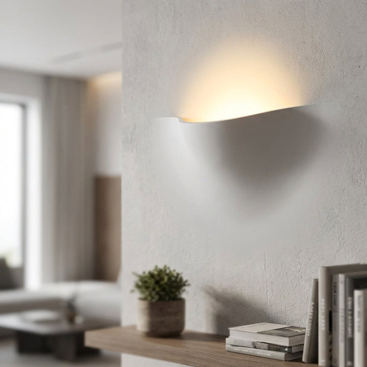Elegant HaloFold minimalist curved LED wall sconce, modern indoor lighting for home decor.