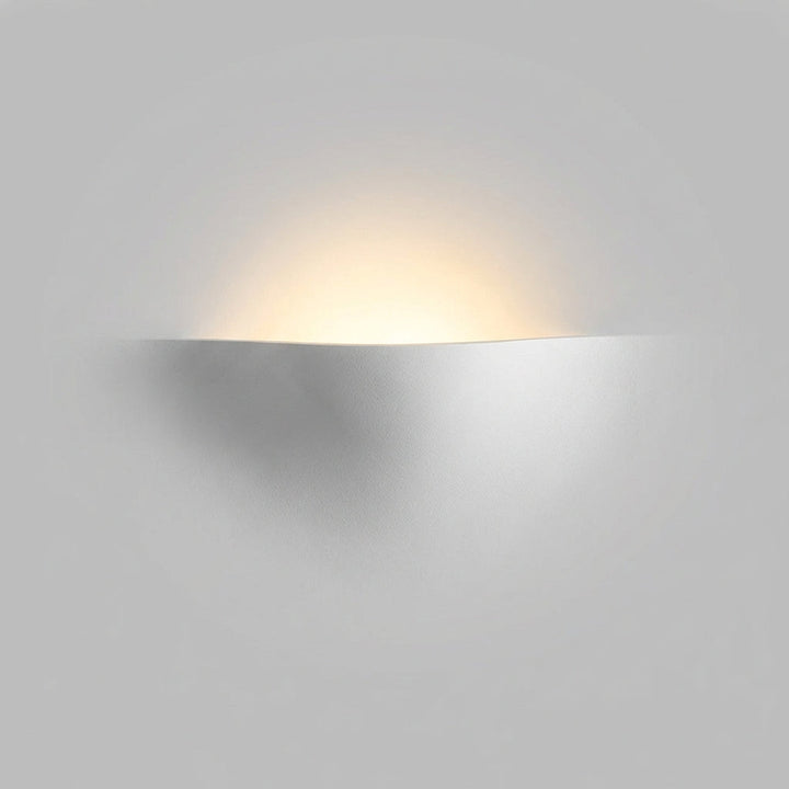 Curved LED wall sconce by HaloFold, providing energy-efficient ambient light with a modern design.