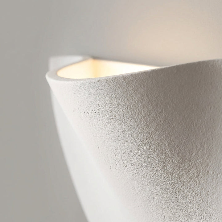 HaloFold minimalist LED wall light with a unique curved design, perfect for contemporary spaces.