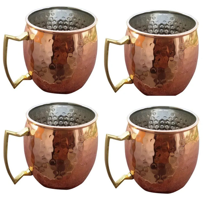 Close-up of a textured hammered copper mug, perfect for Moscow Mules & cold drink enjoyment.