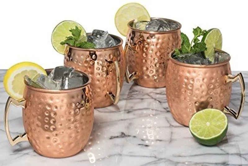 Hammered copper drinkware set with elegant design. Ideal for cold beverages, cocktails & home bar.