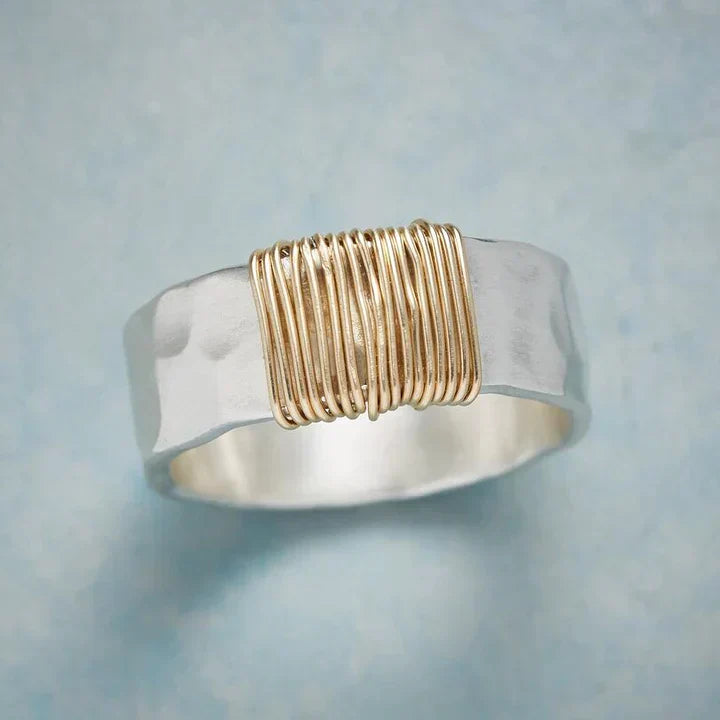 Elegant handcrafted women's vintage sterling silver filigree ring with intricate gold details, a timeless fashion accessory.