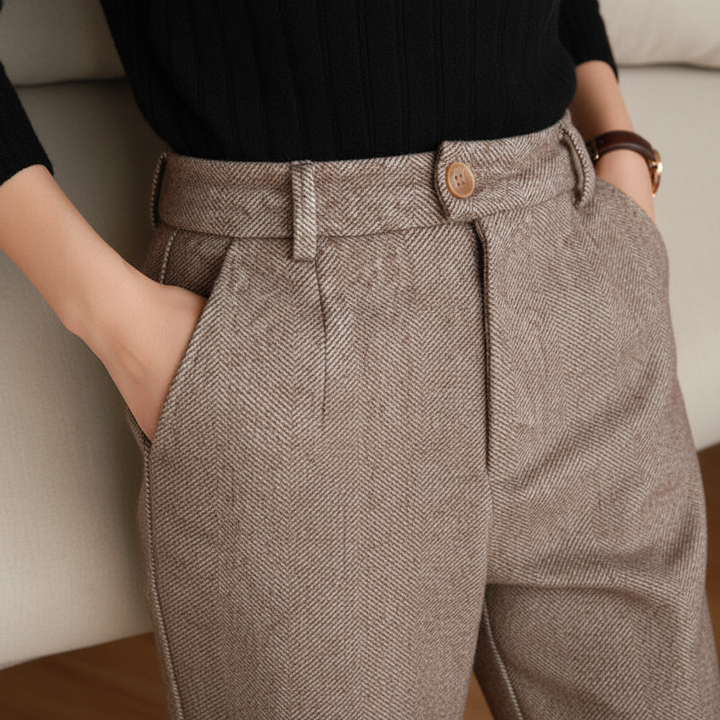 Close-up of high-waist wool harem pants fabric, showing texture and khaki color, winter casual wear