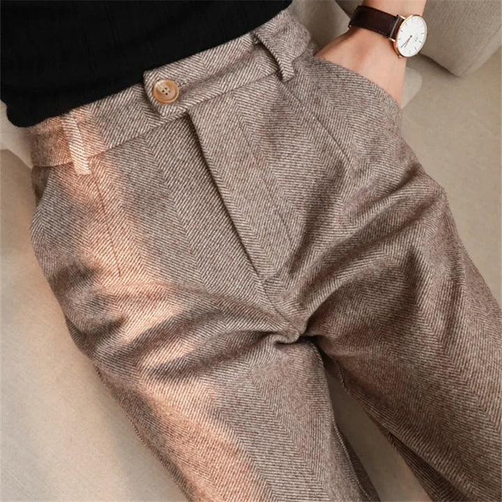 Model wearing comfortable khaki wool harem pants, showcasing high-waist and elegant fall style