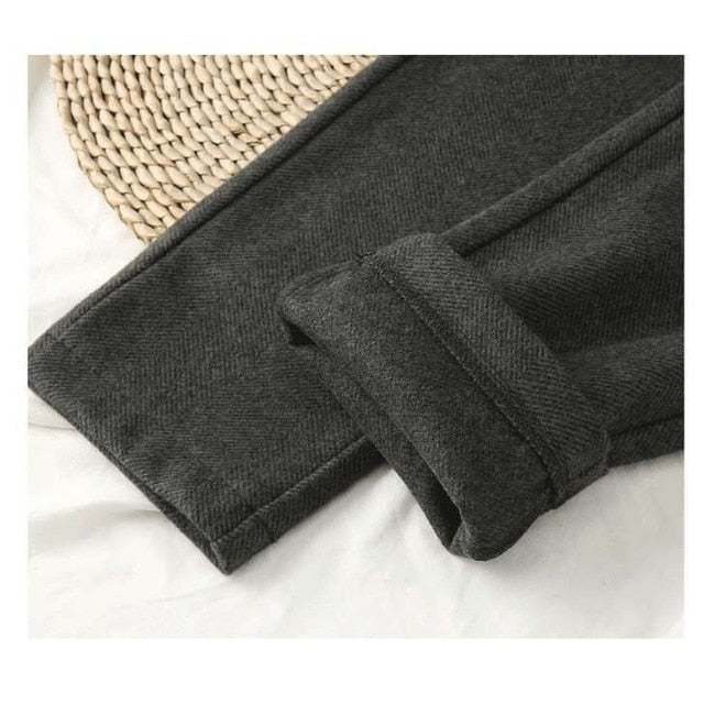 Side view of women in high-waist wool harem trousers, highlighting comfortable fit and khaki hue