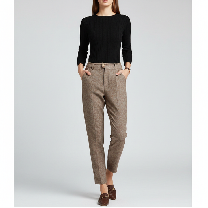 Detail of the high waist on women's khaki wool harem pants, emphasizing elegant comfort