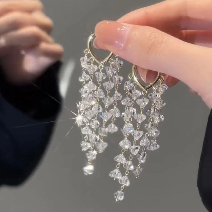 Eye-catching irregular crystal and tassel dangle earrings, elegant women's jewelry for any special occasion.
