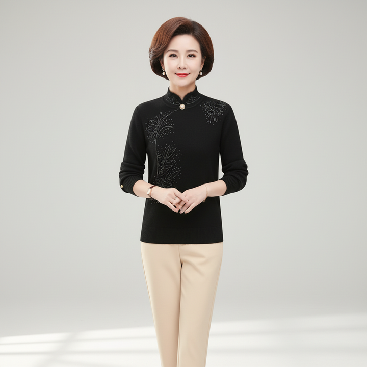 Stylish women's knitted top with high collar, features subtle floral details, ideal for autumn wear.