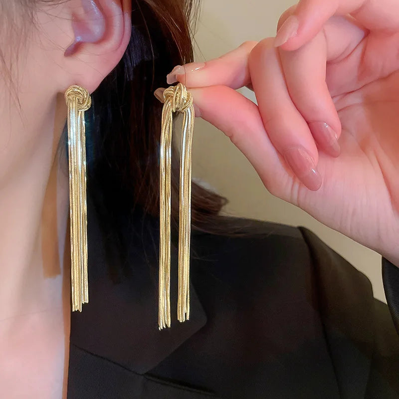 Elegant knot long tassel earrings for women, a stylish statement jewelry piece.