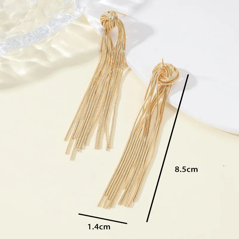 Dainty long tassel earrings with an elegant knot, enhancing women's beauty and jewelry collection.