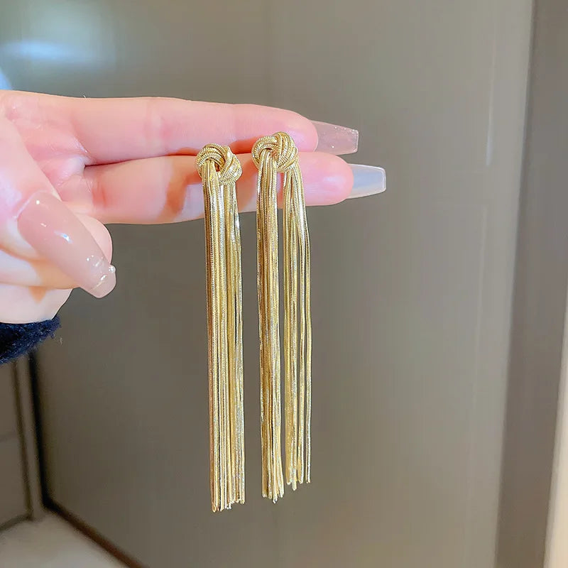 Chic gold-tone knot long tassel earrings, a fashionable accessory for women's elegant style.