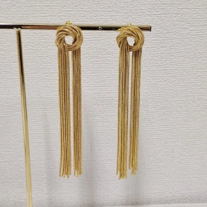 Stylish women's elegant knot long tassel earrings, versatile for both casual and formal wear.
