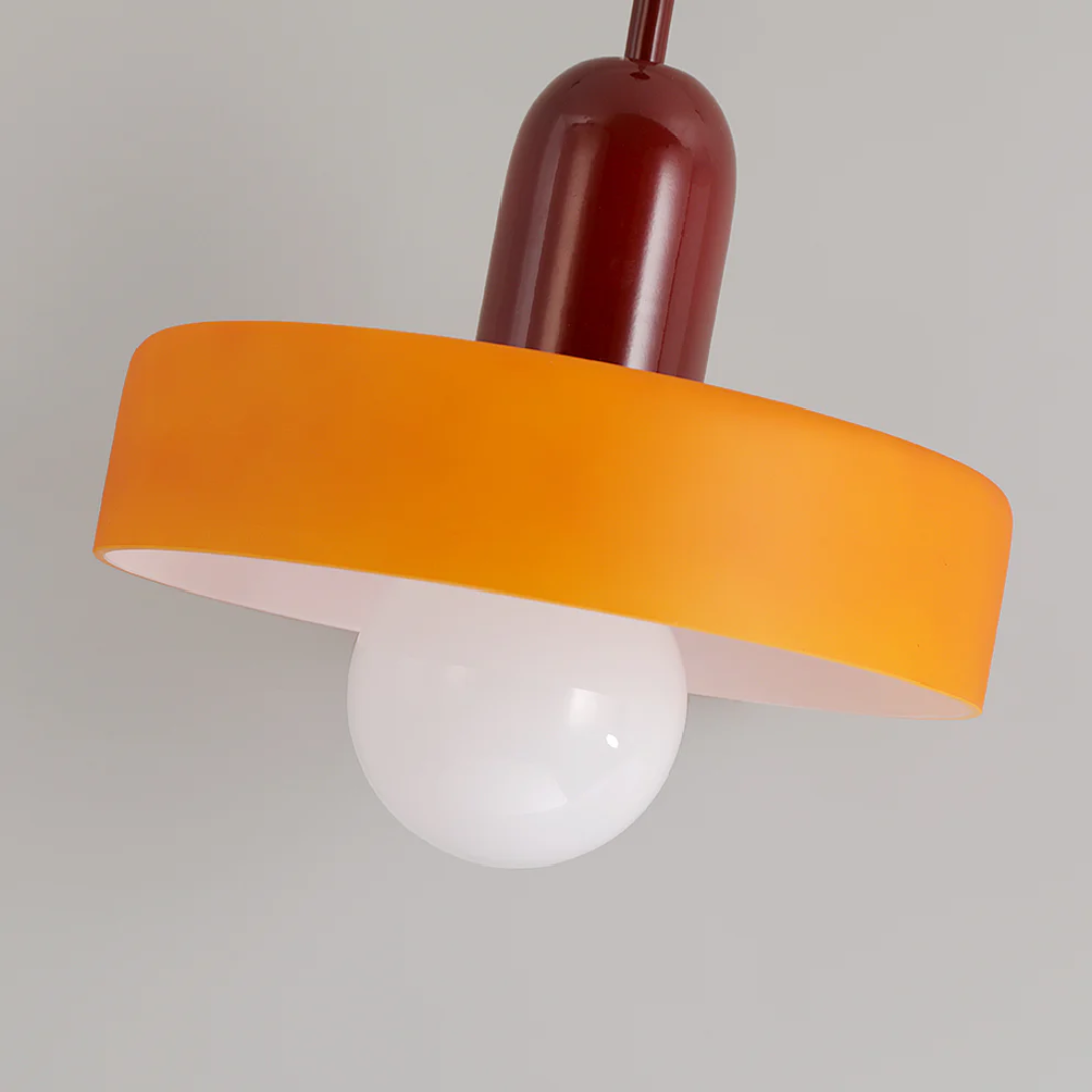 Contemporary LED pendant with glass globe, ideal for modern home interior lighting.