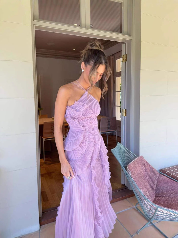 Beautiful lilac halter midi dress featuring delicate pleats & ruffles. A chic choice for homecoming & parties.