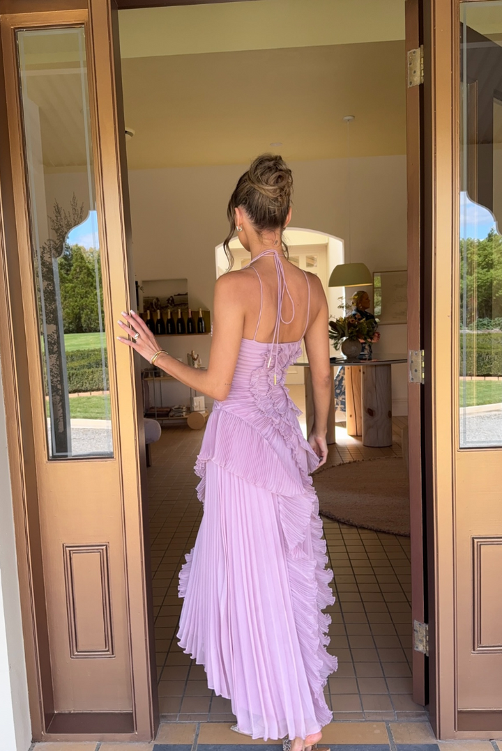 Flowing women's lilac pleated midi dress with a stylish halter neckline and charming ruffles. Elegant & formal.