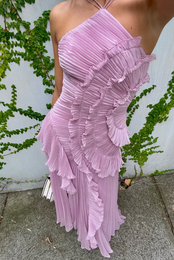Textured lilac pleated midi dress with ruffle accents and a sophisticated halter neck. A gorgeous formal women's dress.