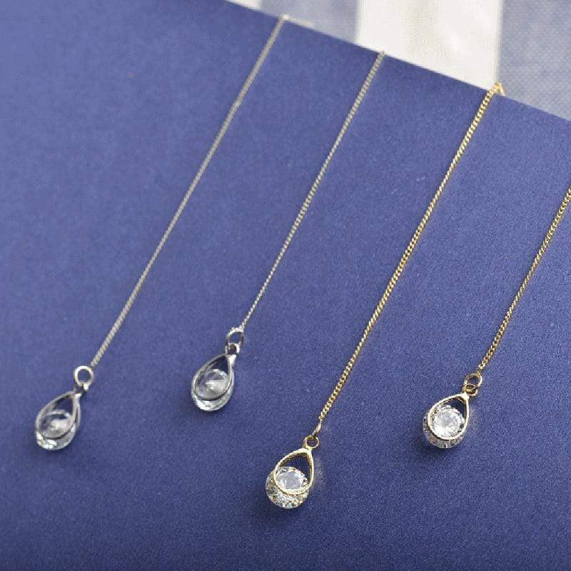Glamorous long rhinestone drop earrings, elegant dangle jewelry for women's special occasions.